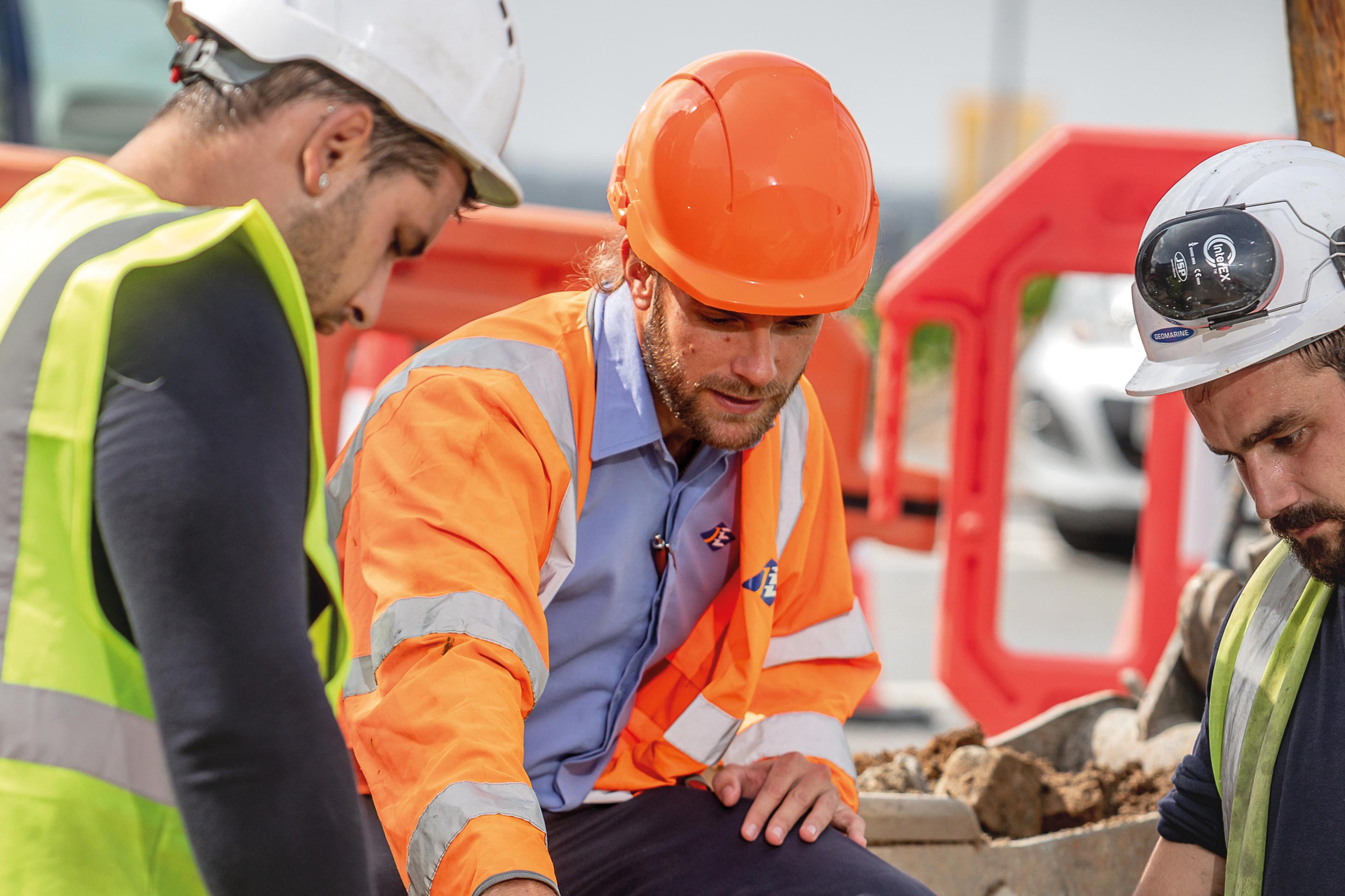 Sam Boleat gives advice to contractors during a constriction project.