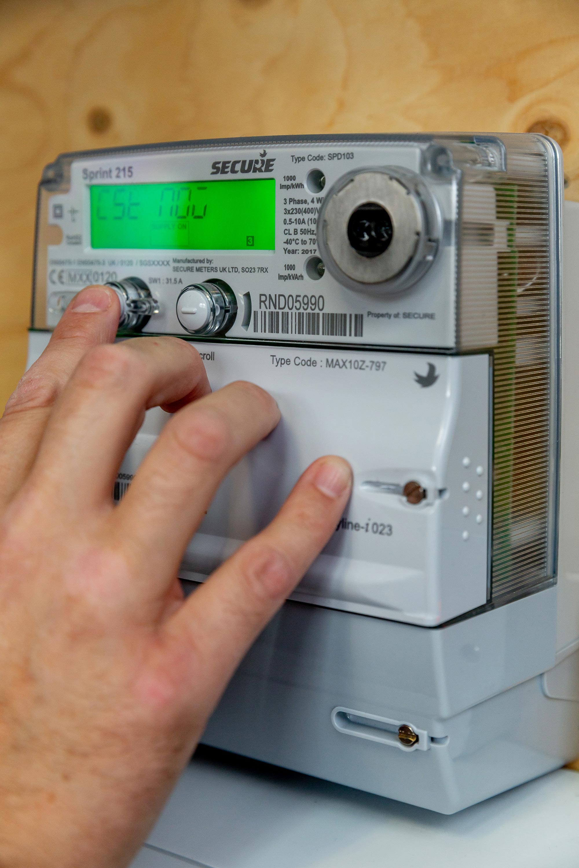 A Jersey Electricity customer operates their smart meter.