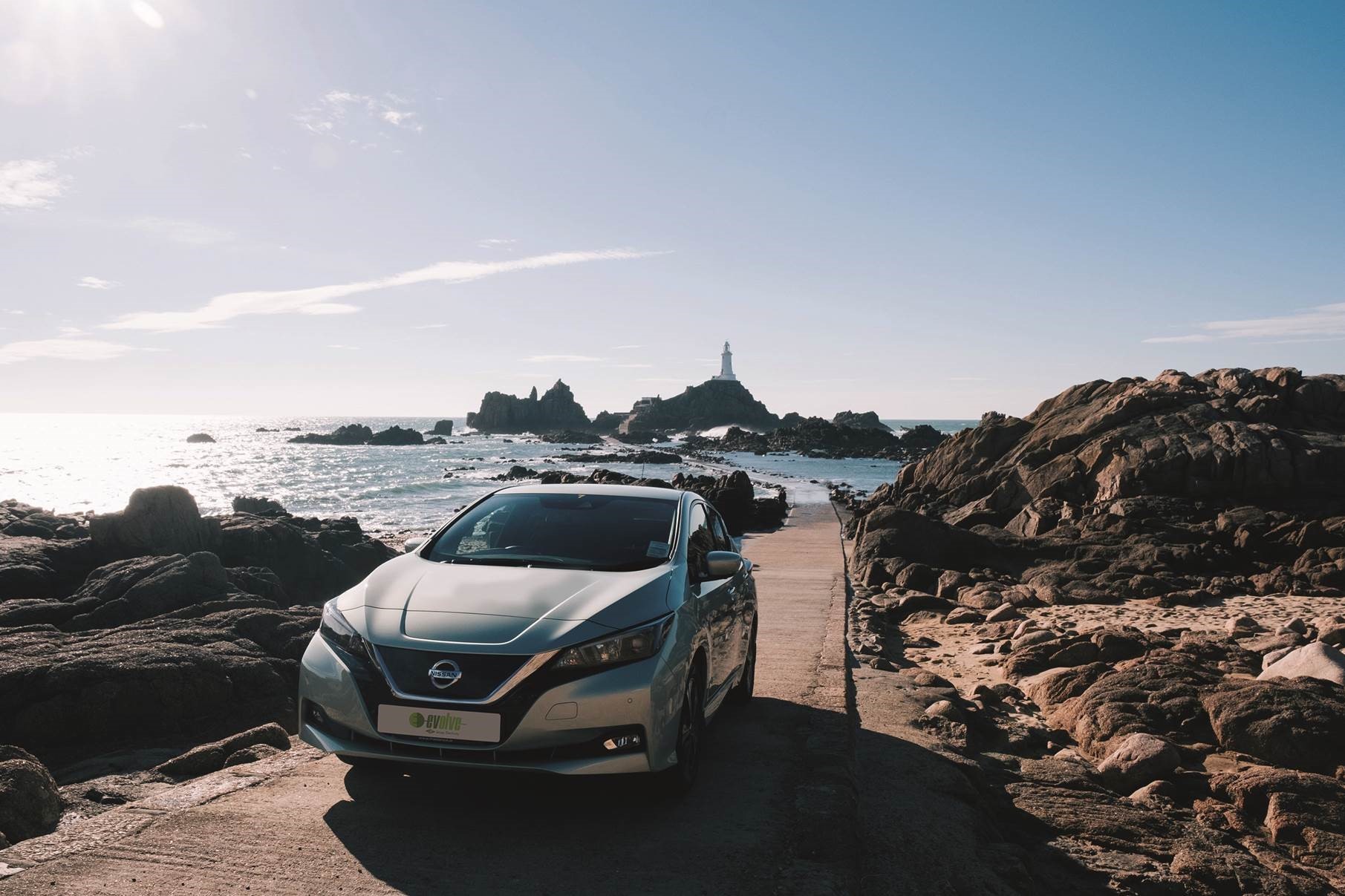 Nissan Leaf drives across causeway at Corbiere in Jersey