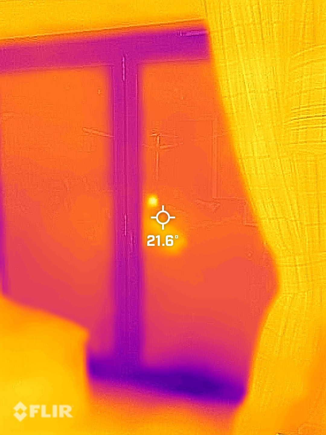 Thermal image from indoors of patio doors with the curtains open
