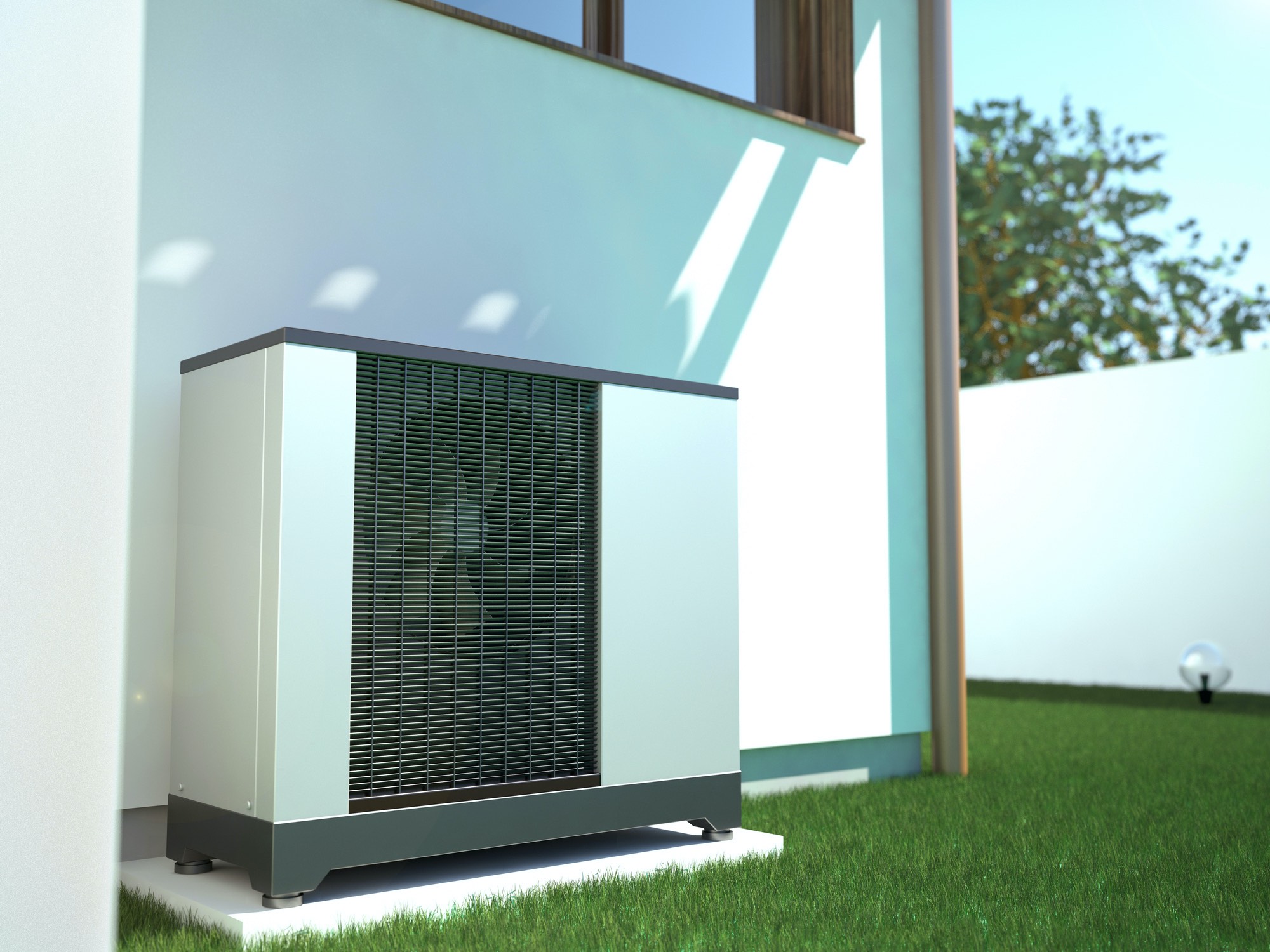 Ground source heat pump outside a modern house