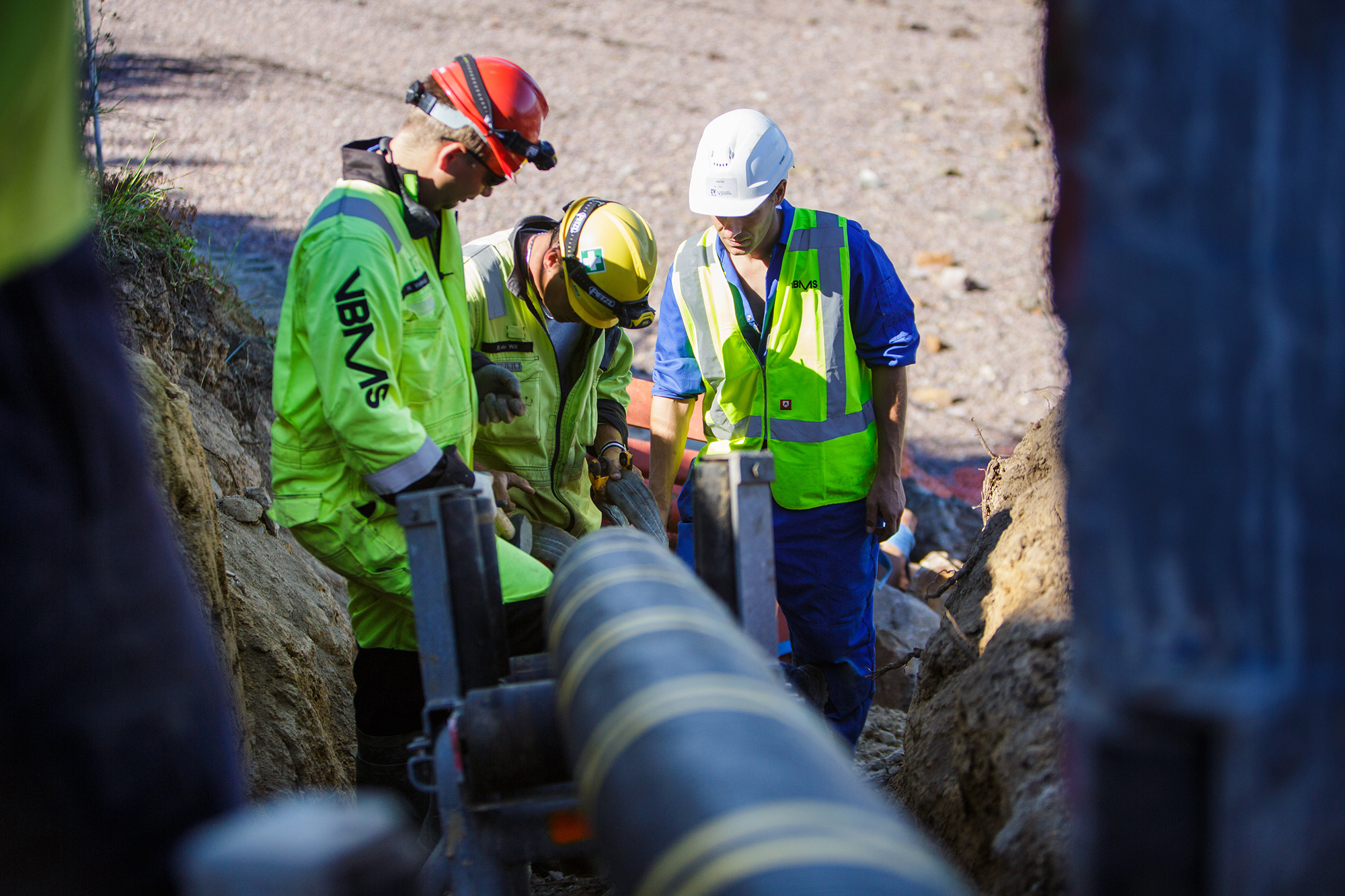 Workmen inspect an undersea power cable