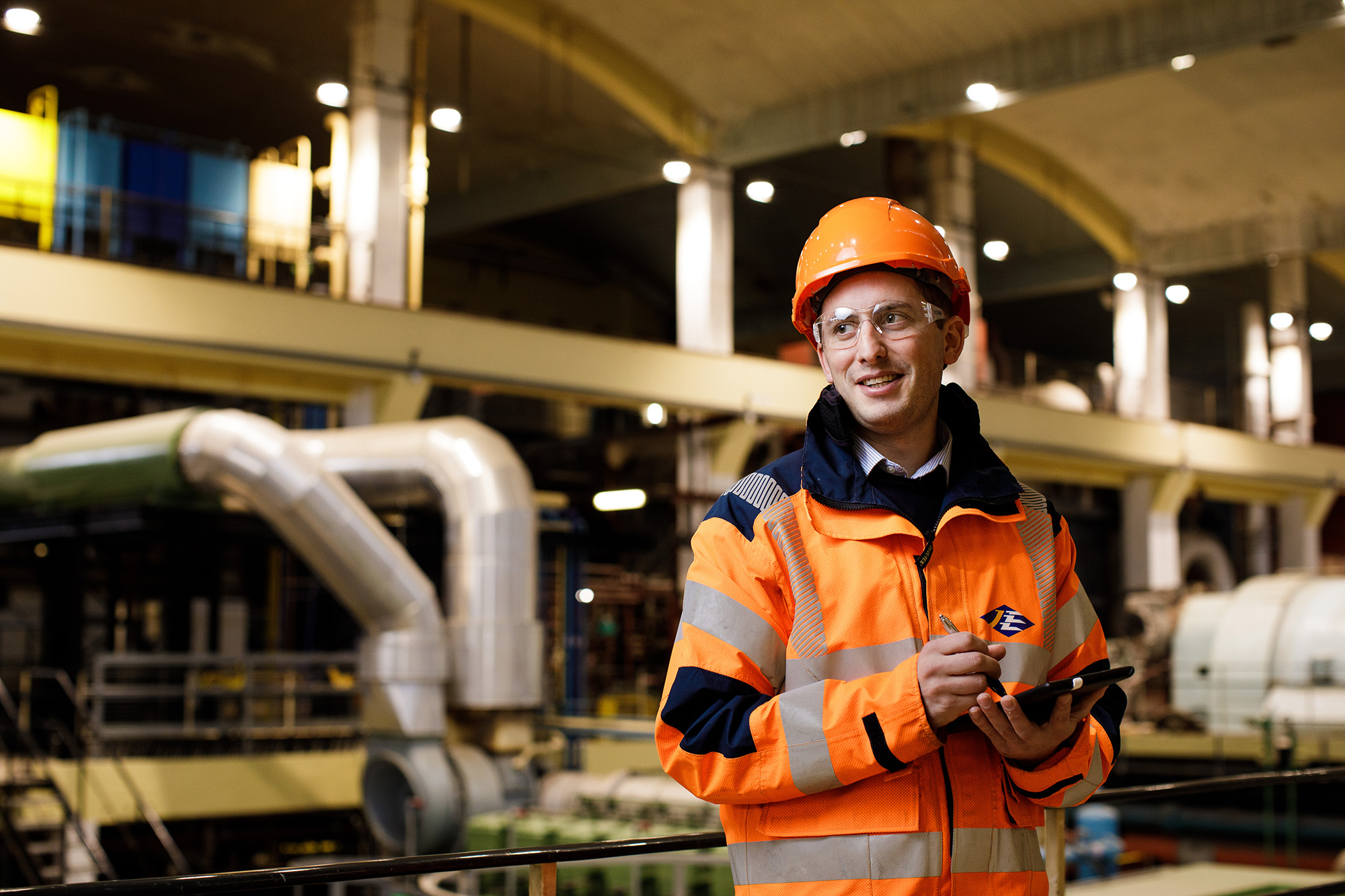 A Jersey Electricity employee takes notes on a tablet