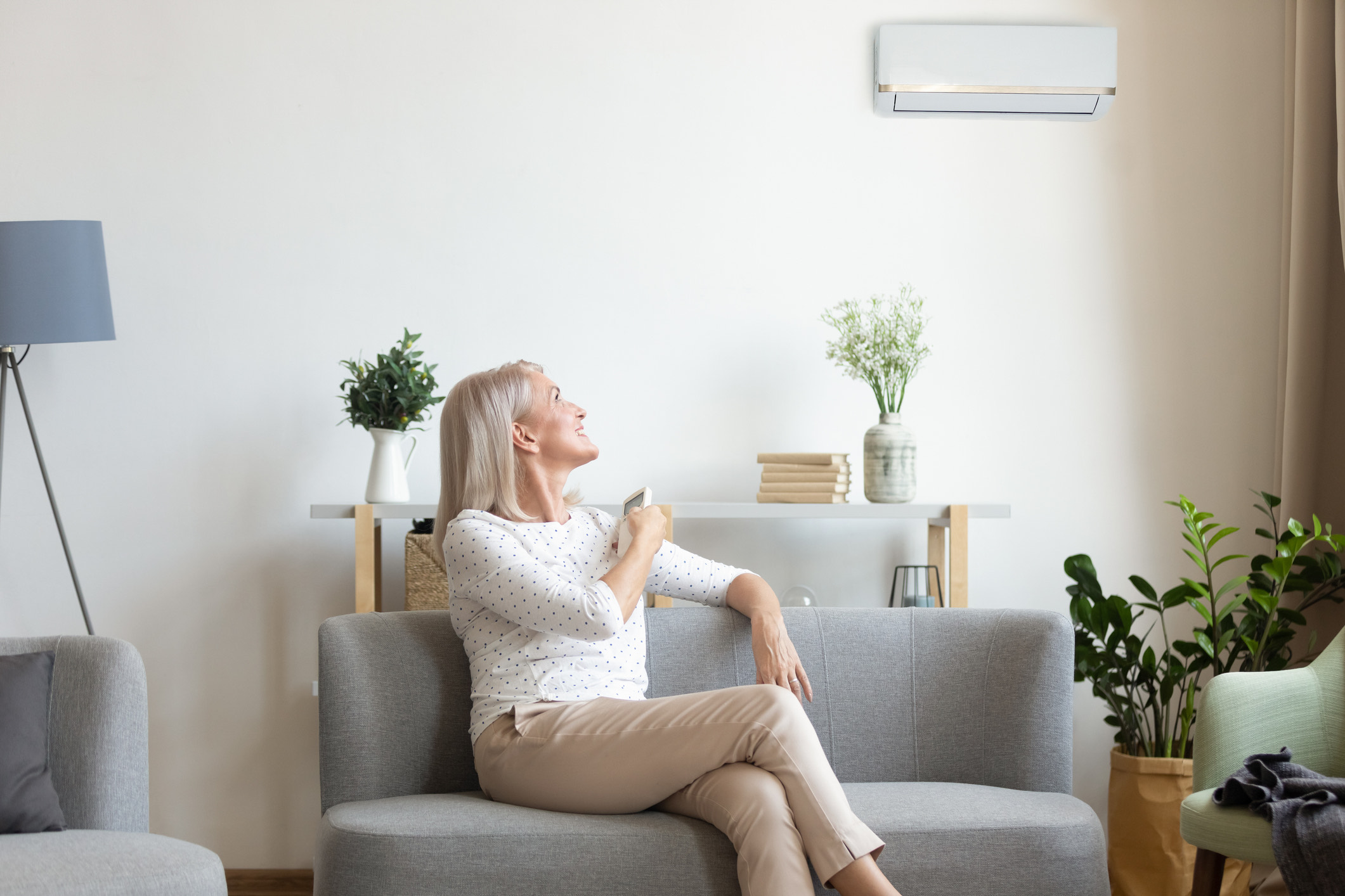 Woman using heat pump at home