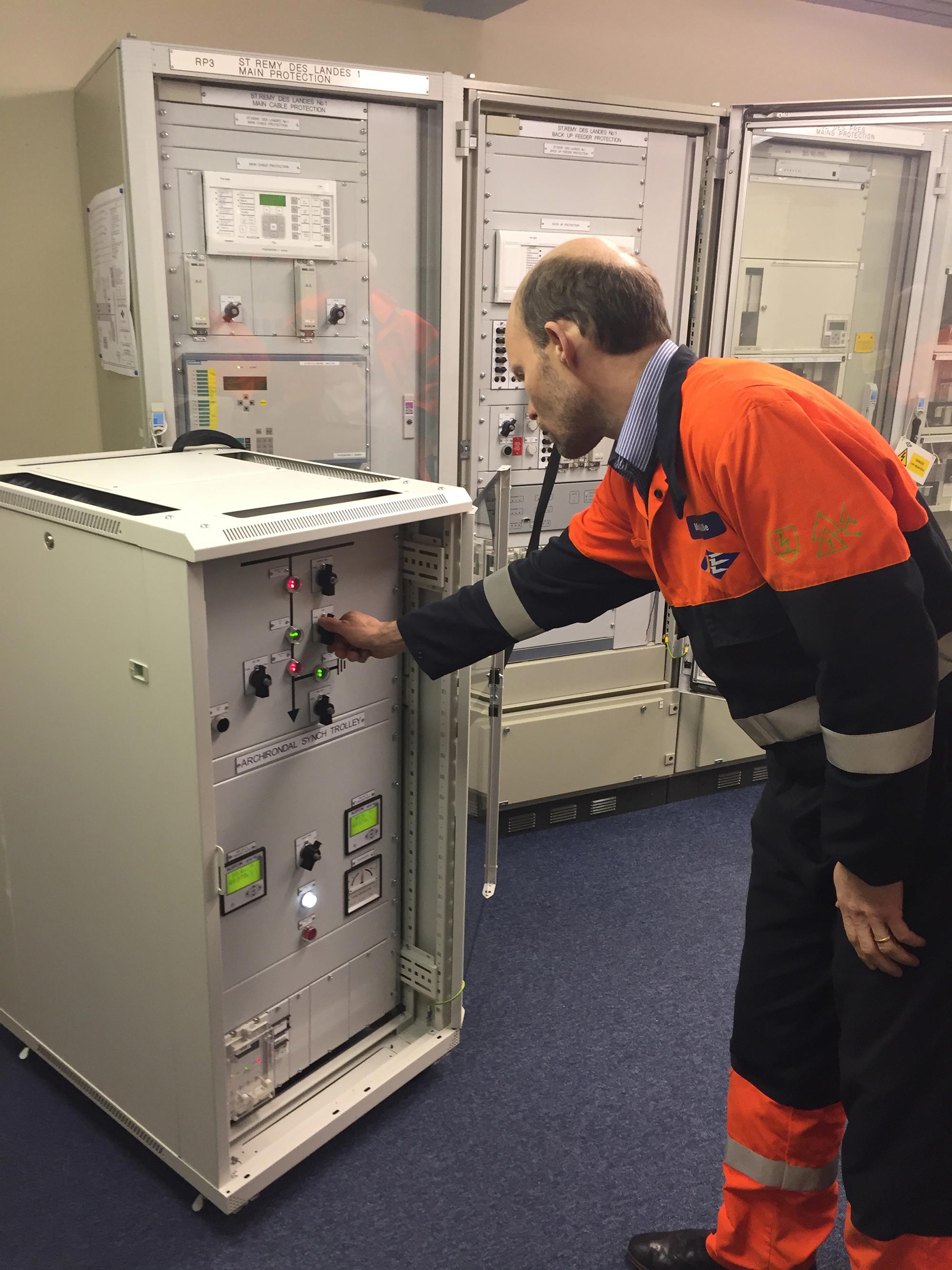 A Jersey Electricity engineer switches on the Normandie 1 cable for the first time.