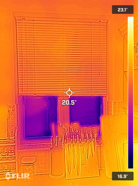 Thermal image of a kitchen window with the blind pulled halfway down