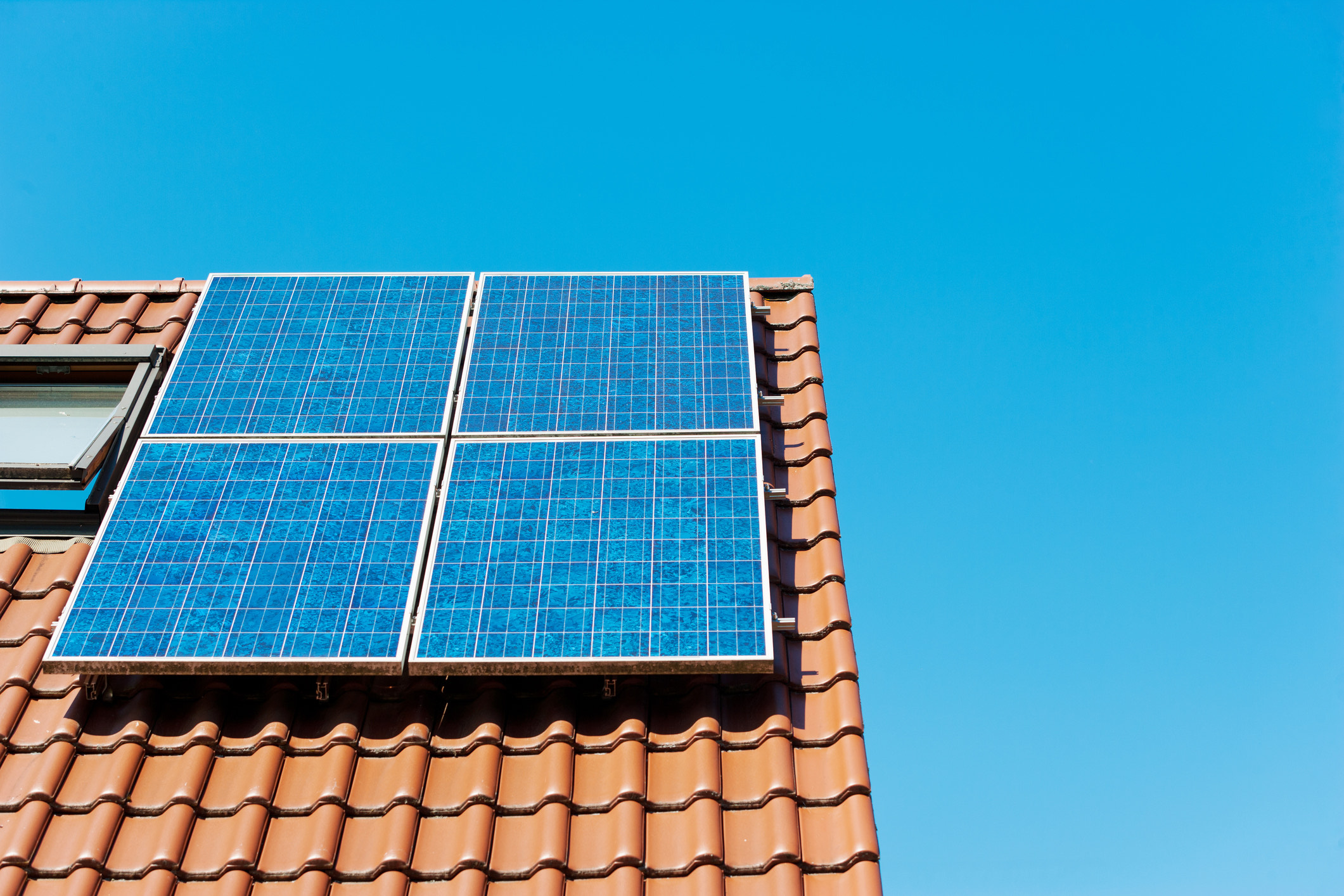 Four solar panels on a roof